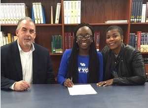 student signing to play softball