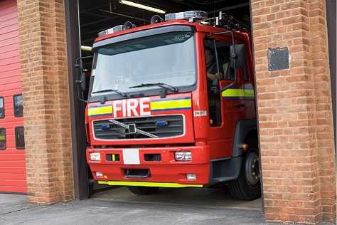 Fire trucking pulling out of garage