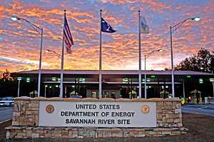 flags and stone sign at entrance of the Savannah River Site