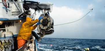 commercial fisherman casting a hook