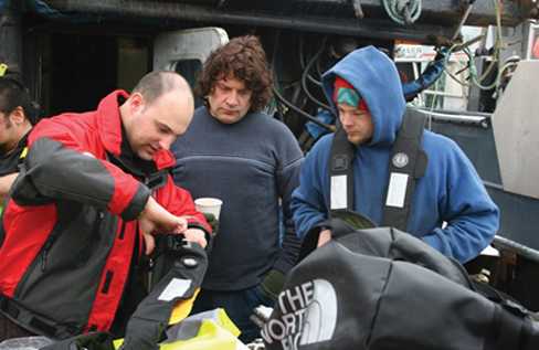 NIOSH researcher demonstrating one of the new types of personal flotation devices on the market