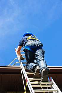 	man climbing a ladder