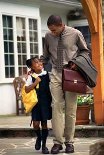 Man and small girl walking together.