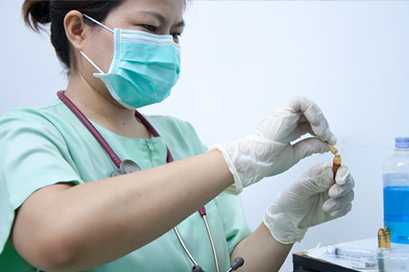 	nurse filling a bottle