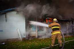 	Fireman put out building fire