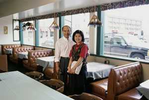 	Two restaurant employees on the job