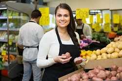 Grocery worker in produce section