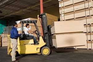 Warehouse worker on forklift