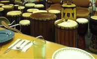 	Drums in an event room of a community organization building before a meal and drumming circle event.