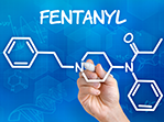 Hand with pen drawing the chemical formula of fentanyl