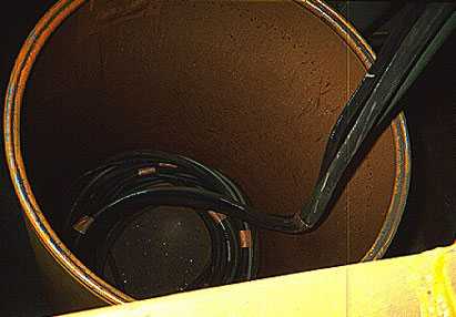 	Cable coils into recycle drum