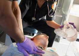 	Paramedics performing CPR on a patient.