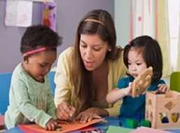 	Woman playing with 2 children