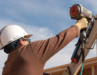 	Construction worker using a nail gun.