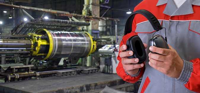 man testing headset in machine warehouse