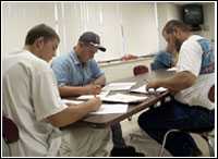 Workers training at a table