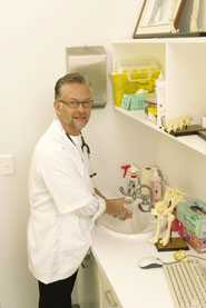 	Veterinarian washing his hands.