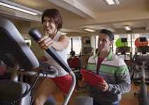 	woman using exercise machine