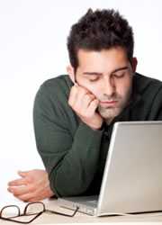 man asleep at his desk