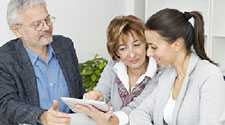 	Man and 2 women reviewing document