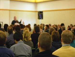 Audience of people listening to a speaker