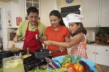 A family preparing a healthy meal.