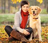 Woman sitting outside with dog