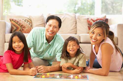 Family playing a board game together