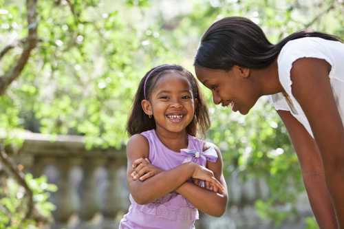 Mom talking to daughter in the park