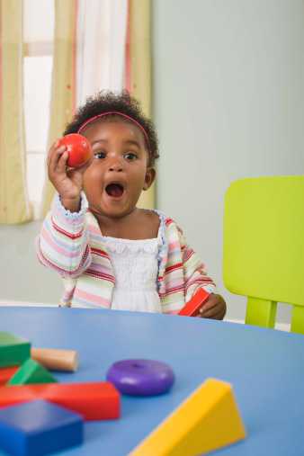 Toddler holding a ball