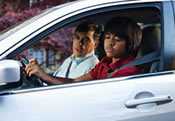 photo: father and son in a car