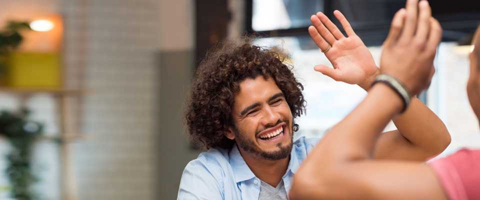 friends high fiving