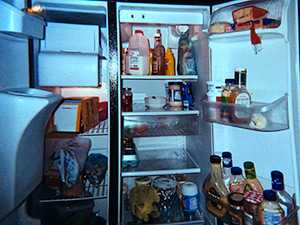 	Photo of an open refrigerator with food inside