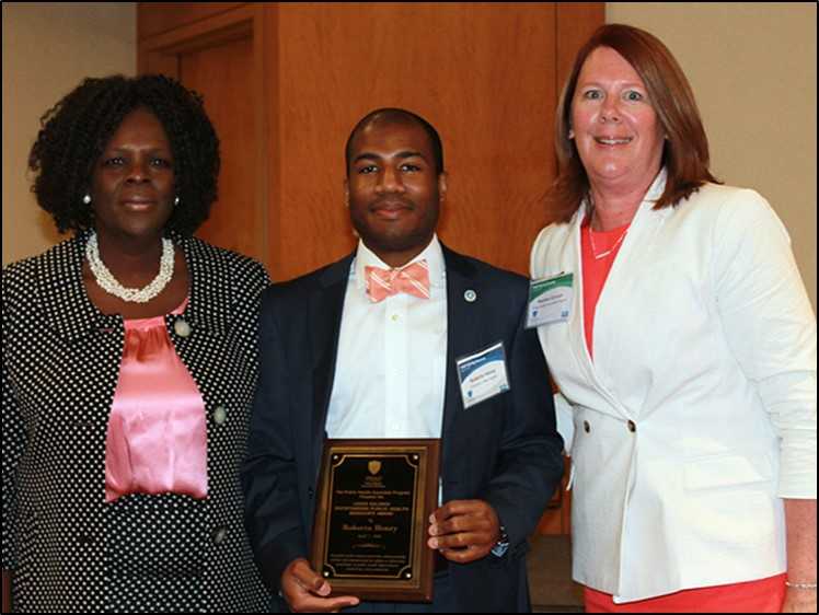 Roberto receiving the 2016 Salinas Award for his exemplary work in public health from his CDC supervisor, Margaret Patterson (left), and PHAP Director Heather Duncan (right).