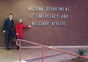 1/10/2013 – Ethan Riley and Judy Kioski, the leaders behind the Emergency Kit Cook-off campaign, pose outside of their offices.