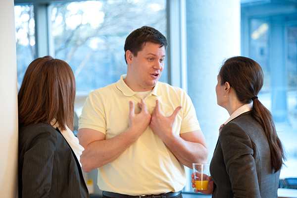 Ethan Riley speaking with Cori Wigington and Victoria Harp