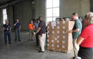 Men talking inside a warehouse