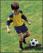 boy playing soccer