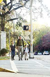 	Dad walking with two kids