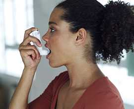 woman using an inhaler