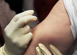 Clinician demonstrates the use of a bifurcated needle during the 2002 Smallpox Vaccinator Workshop.