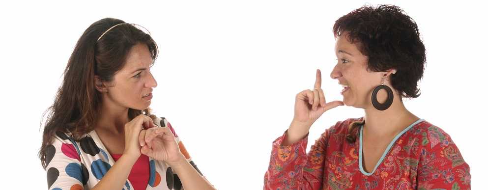 Image of two women speaking with their hands