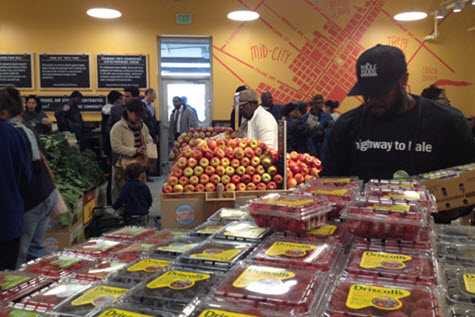 Man picking berries from grocery store