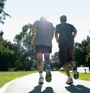  Two older men jogging outside 