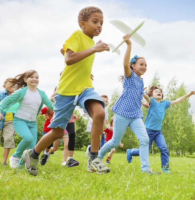 Group of children playing in a field