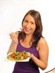 Woman eating salad