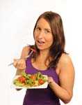 Woman eating salad