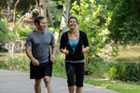 Man and woman exercising in park