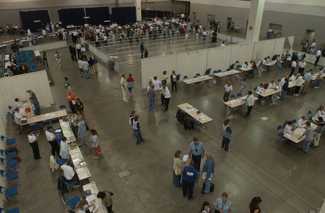 Public health workers setting up a mass vaccination clinic