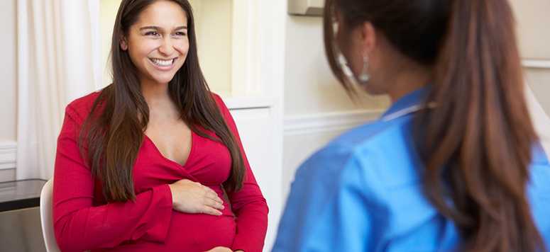 Pregnant lady with doctor